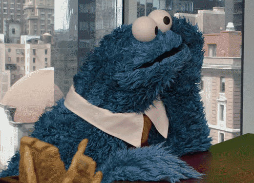 Cookie Monster tapping his fingers on desk